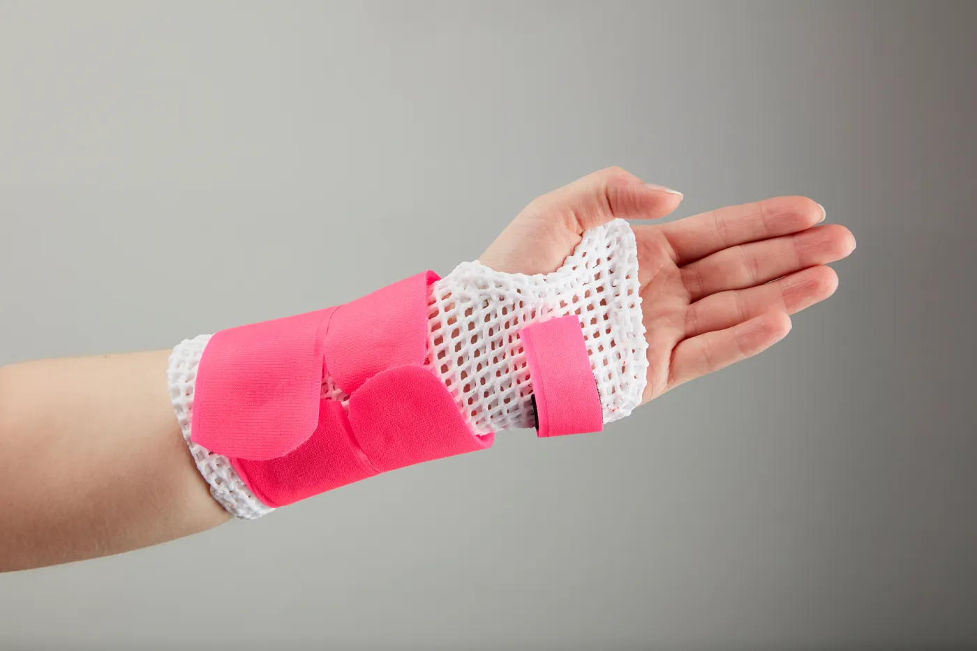 Tutore polso-mano in X-Lite Plus con fasce rosa